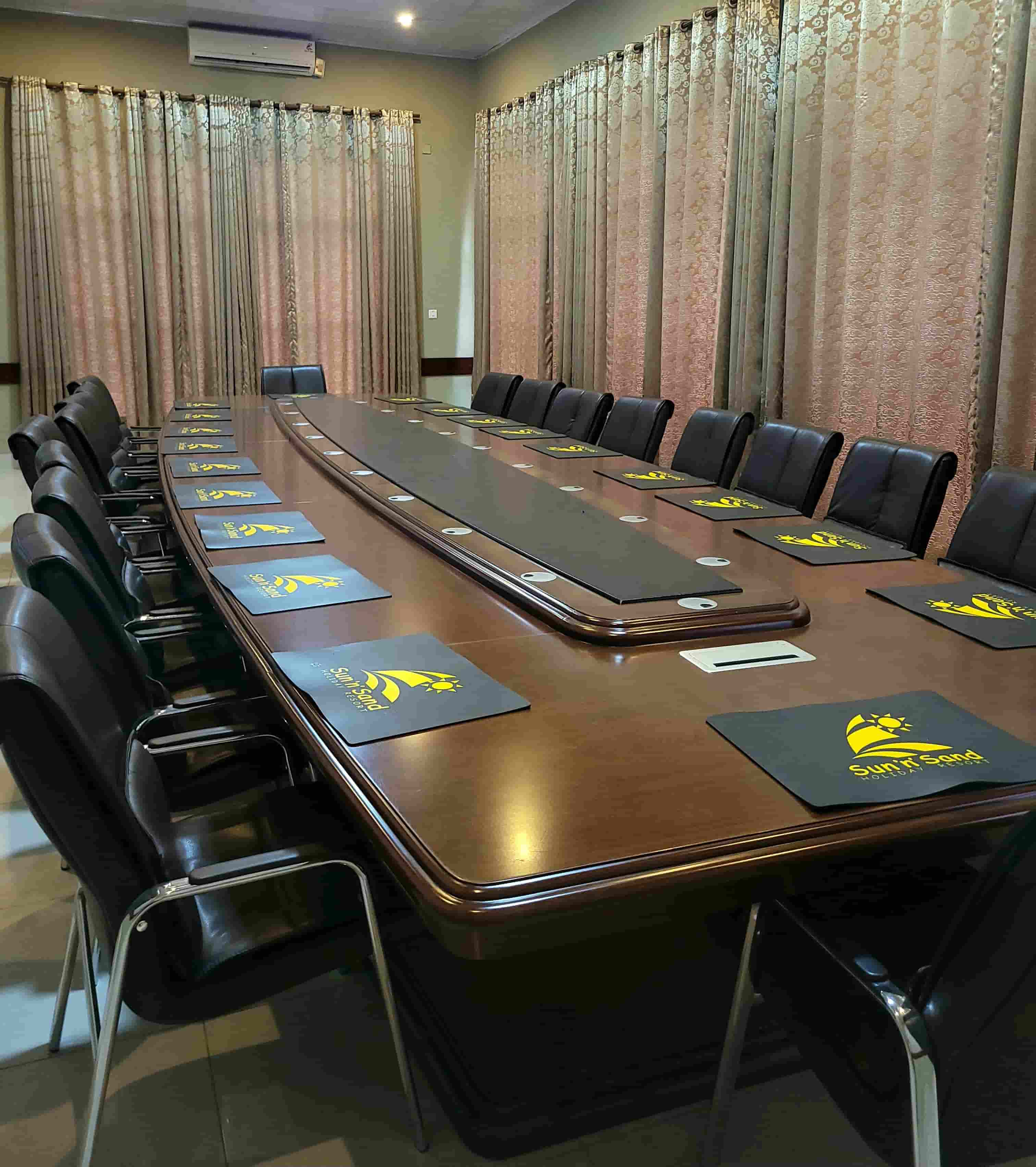 inside view of boardroom with chairs around a table