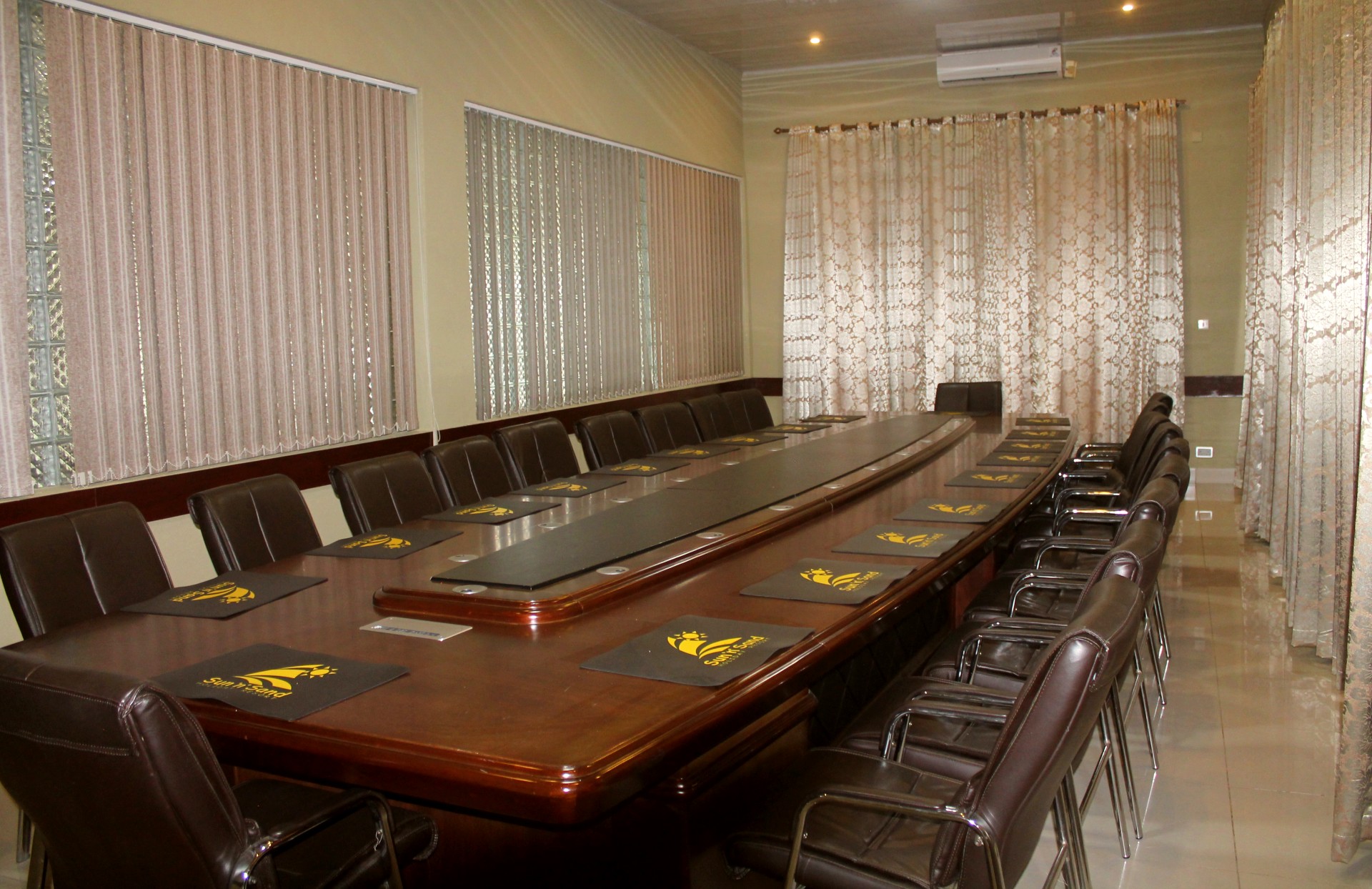 inside view of boardroom with table and chairs arranged around it