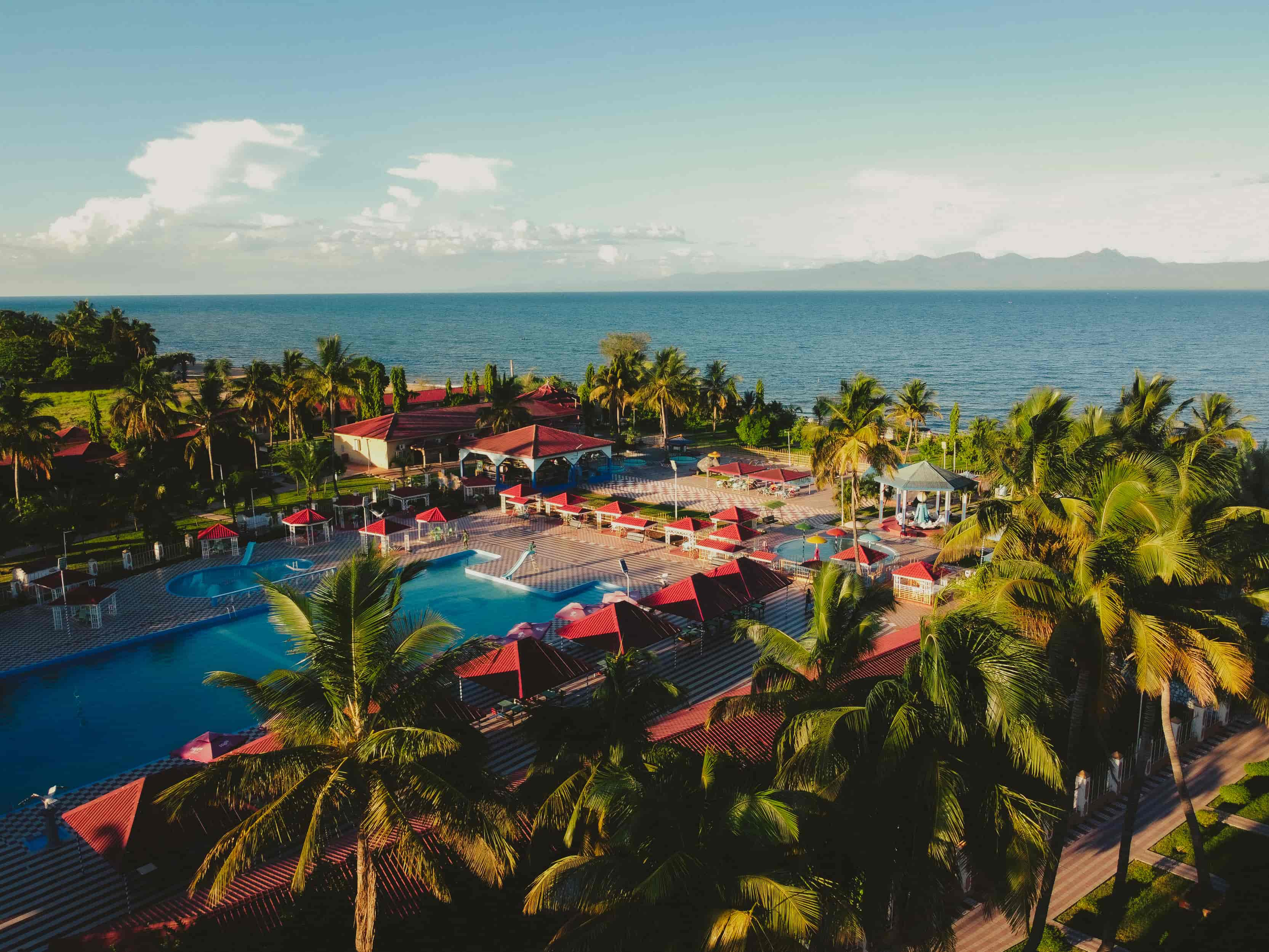 aerial view of swimming pool and lake