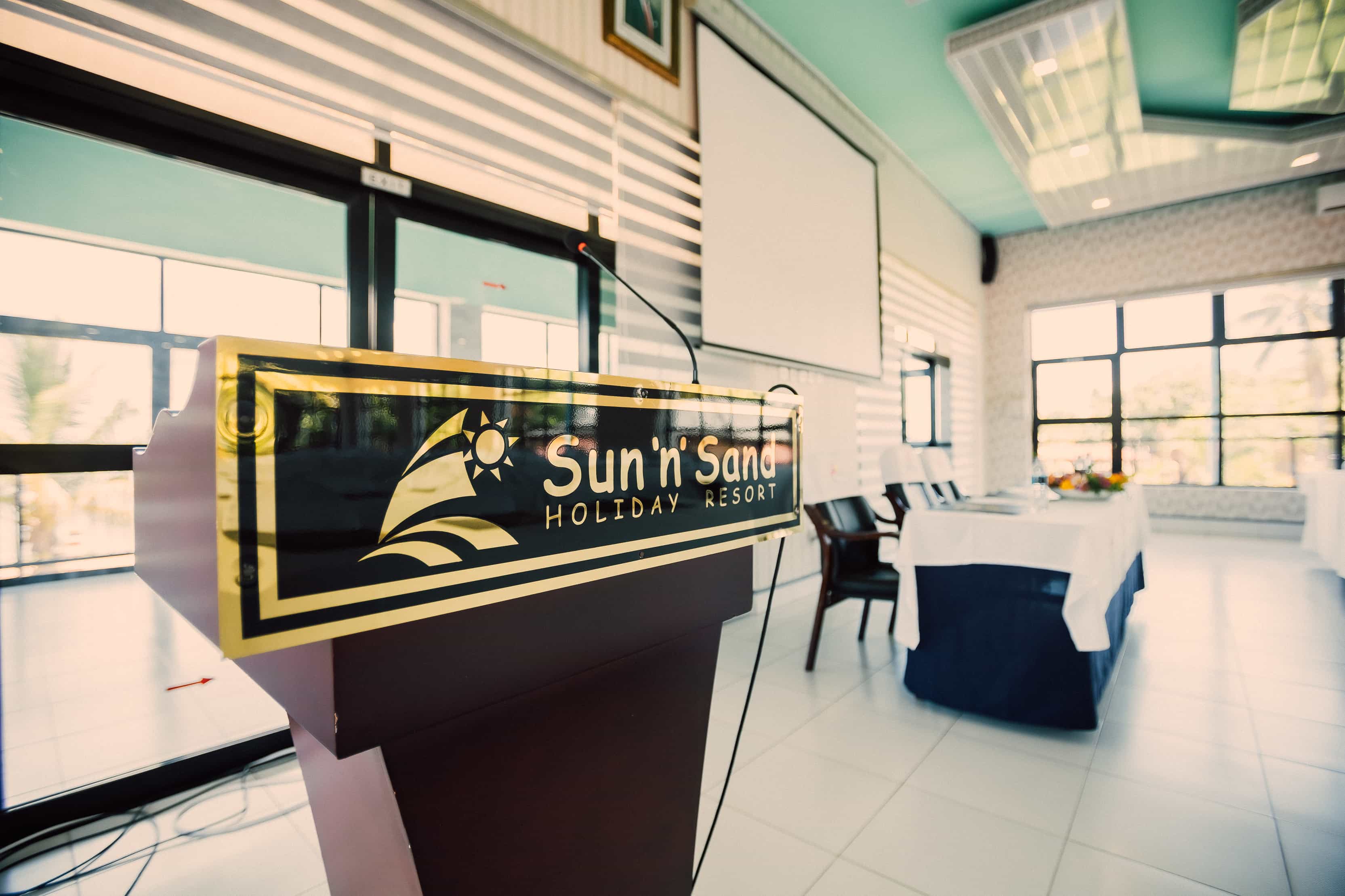 podium with sun n sand logo in lecture_hall