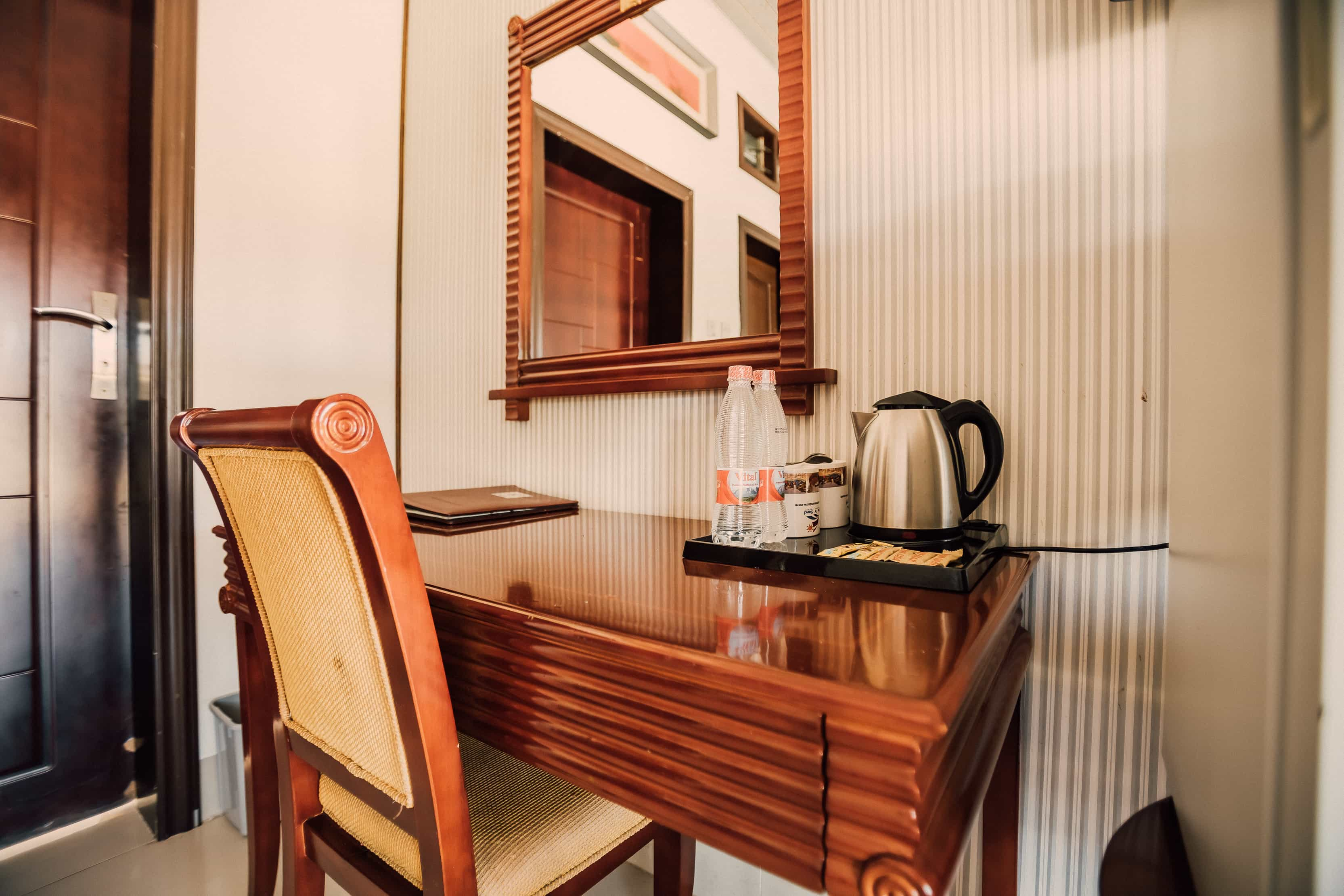 close up of dresser with beverage amenities