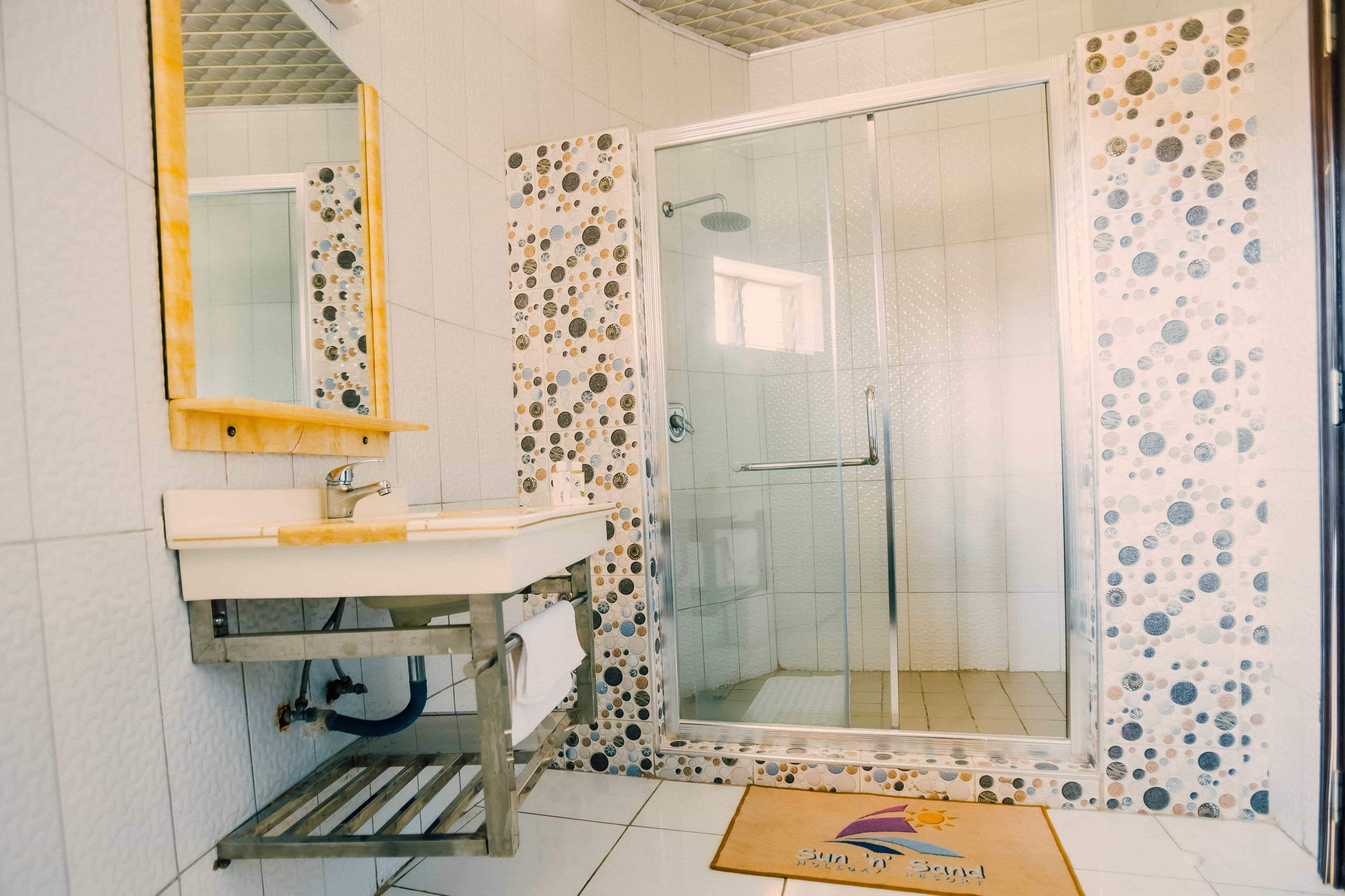 inside view of bathroom with sink and shower