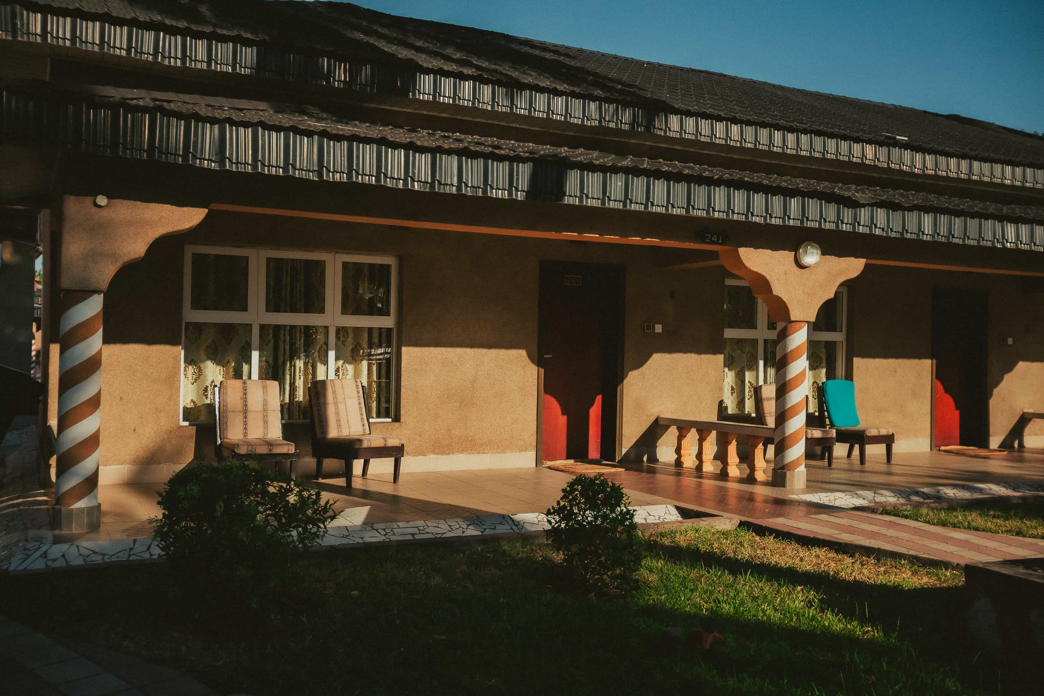 outside-view-of-2-rooms-with-chairs-outside