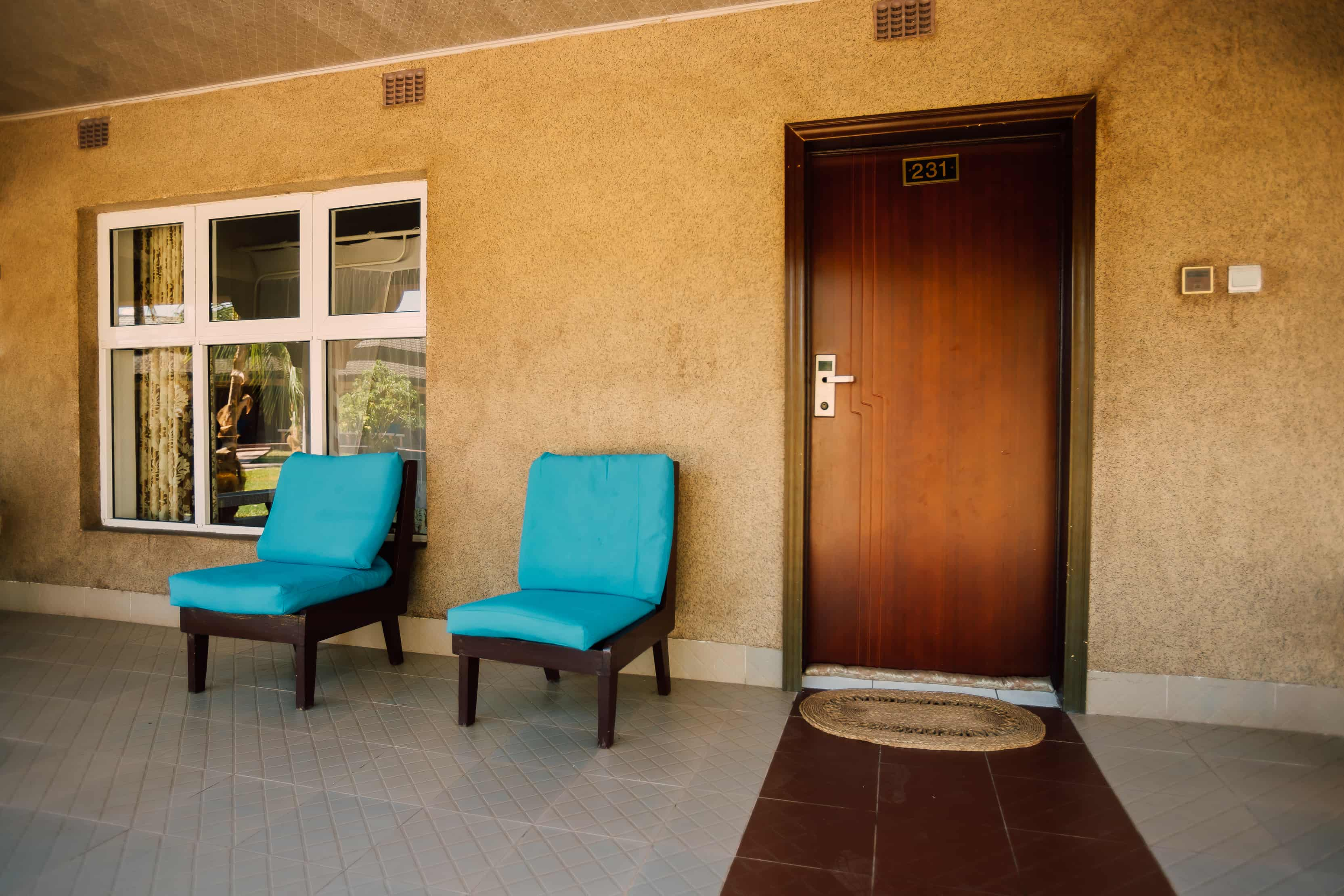 outside view of room with 2 chairs and room number 231