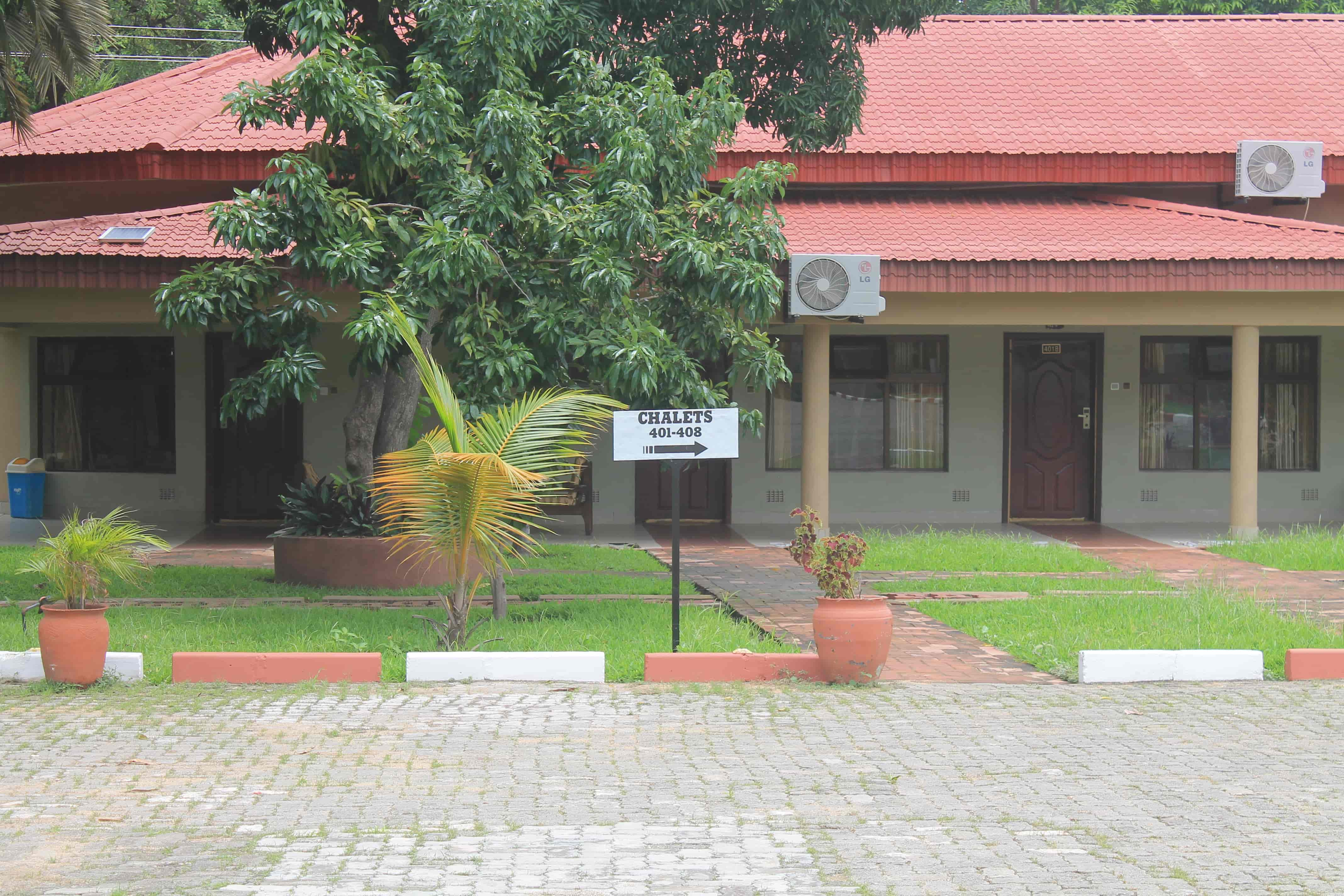 outside view of chalet rooms with sign